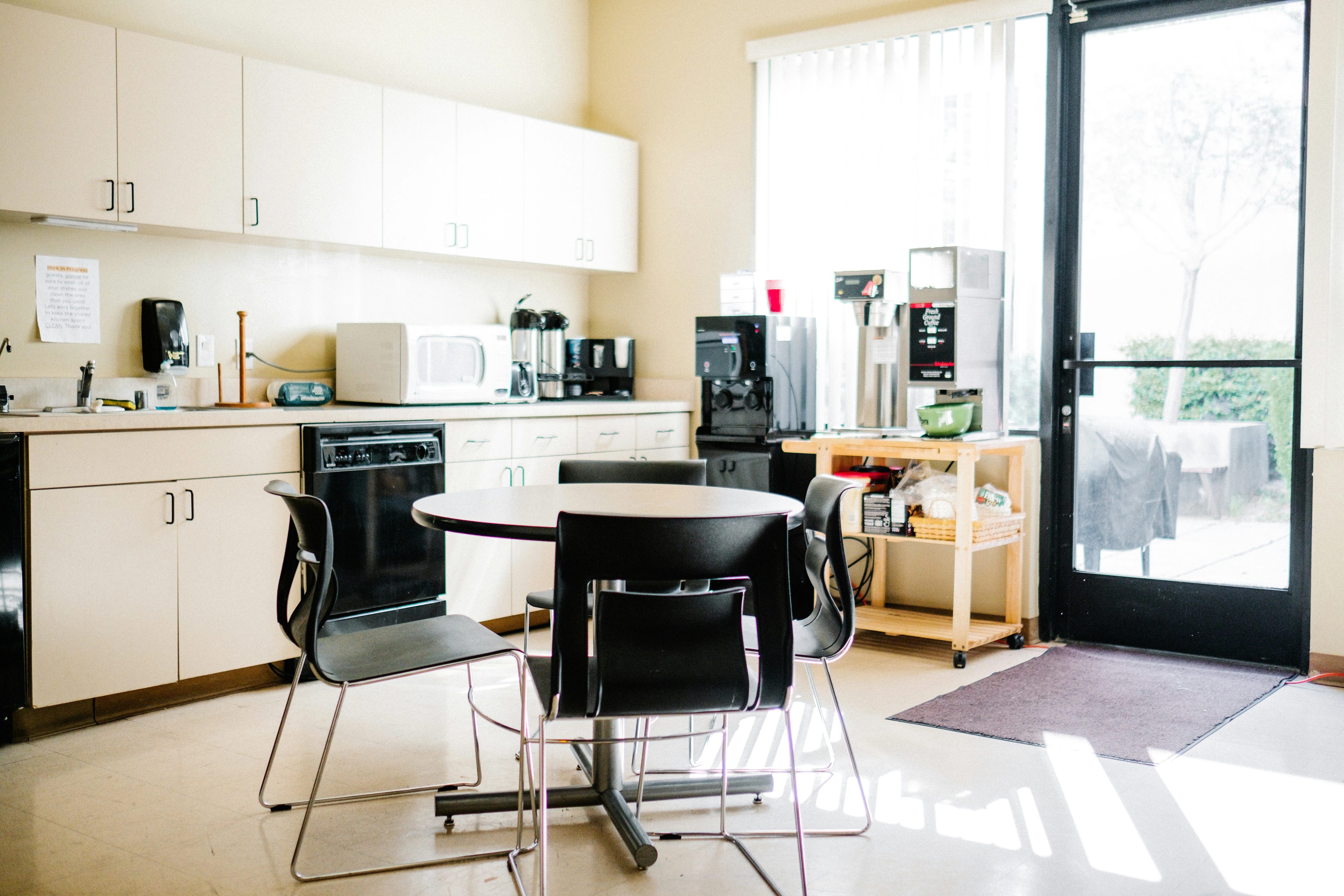 Original kitchen with dated cabinets and counters
